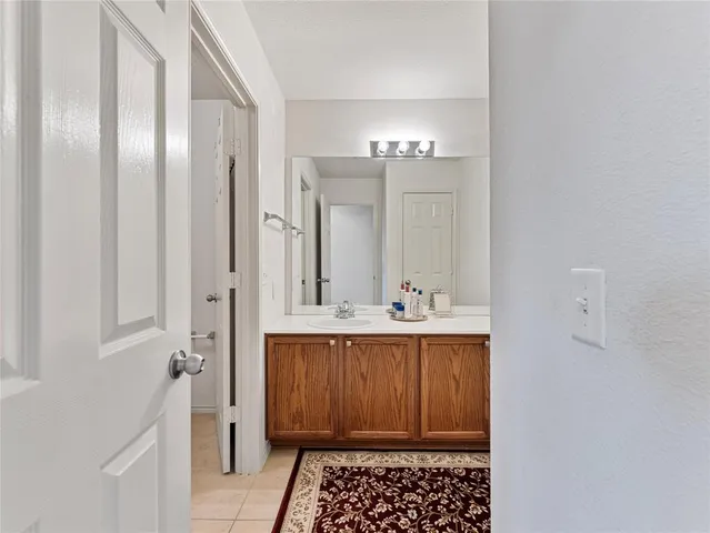a white toilet sitting next to a bath tub