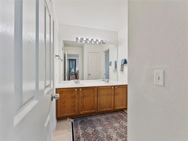 a white toilet sitting next to a bathroom sink