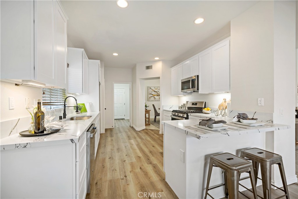 177 Ropango Way Hemet, CA 92545 - Photo 1 of 1 a kitchen with a sink appliances and cabinets