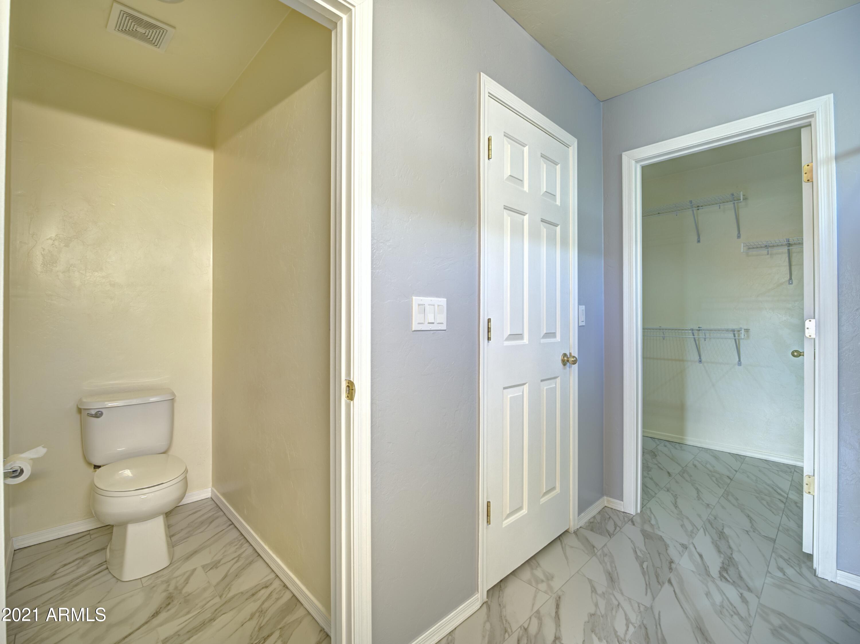 982 Circulo Tumbleweed Rio Rico, AZ 85648 - Photo 19 of 28 a bathroom with a toilet and a shower