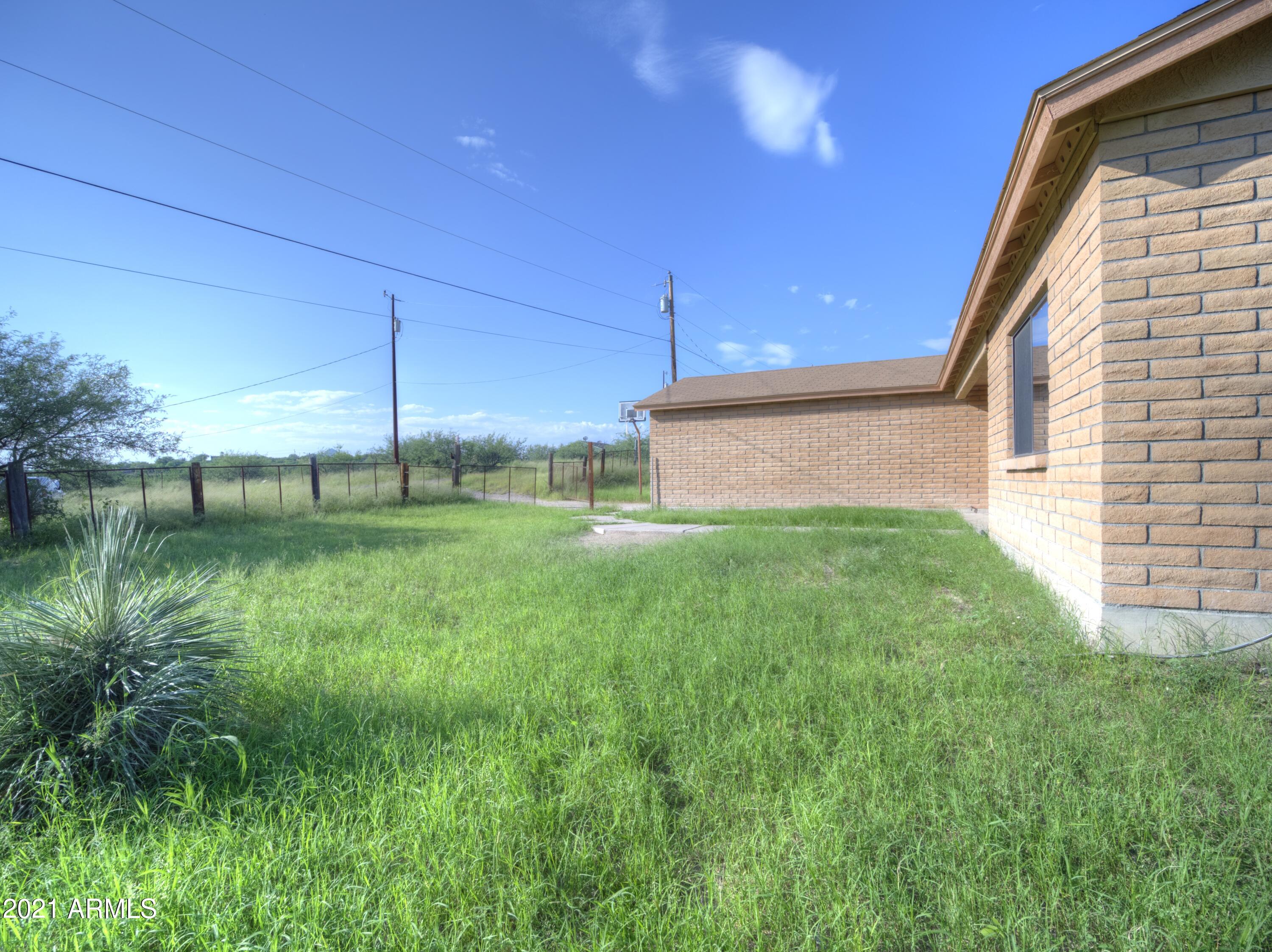 982 Circulo Tumbleweed Rio Rico, AZ 85648 - Photo 6 of 28 a view of a back yard of the house