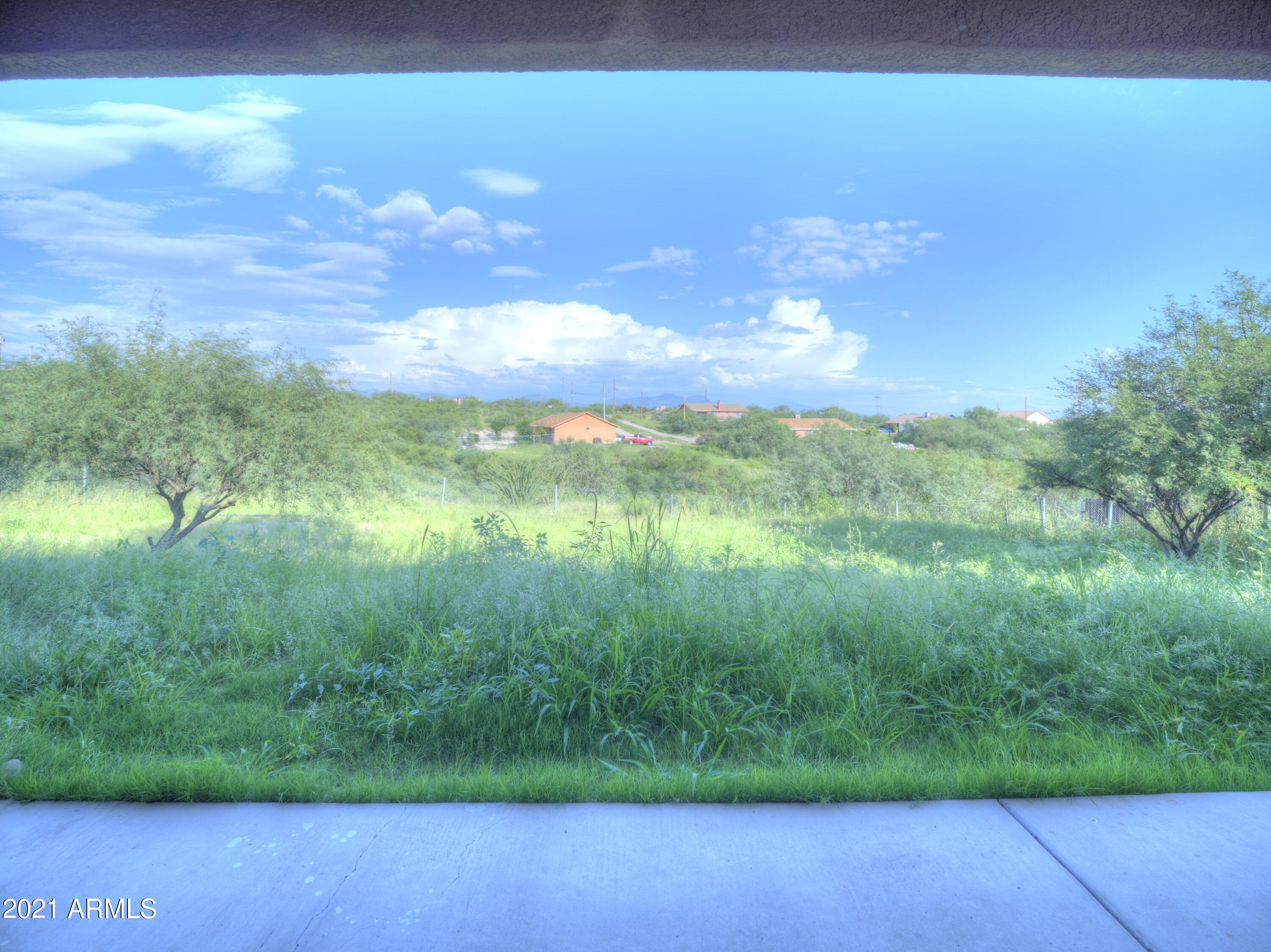 982 Circulo Tumbleweed Rio Rico, AZ 85648 - Photo 8 of 28 a view of yard with swimming pool