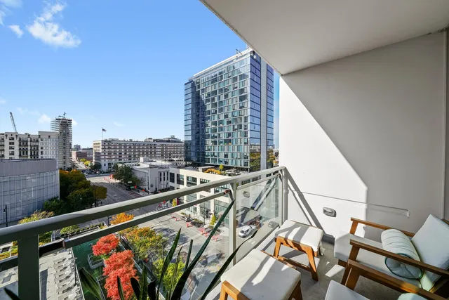 a view of balcony with furniture