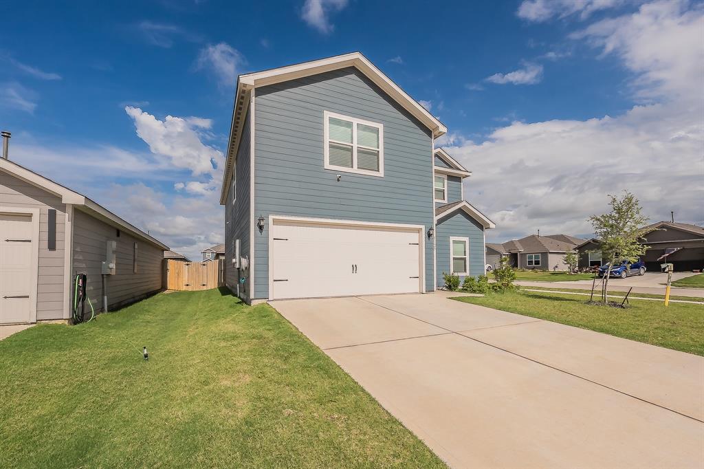 8125 White Sulphur Road Ponder, TX 76259 - Photo 3 of 38 Two-story residence featuring blue horizontal siding and white trim