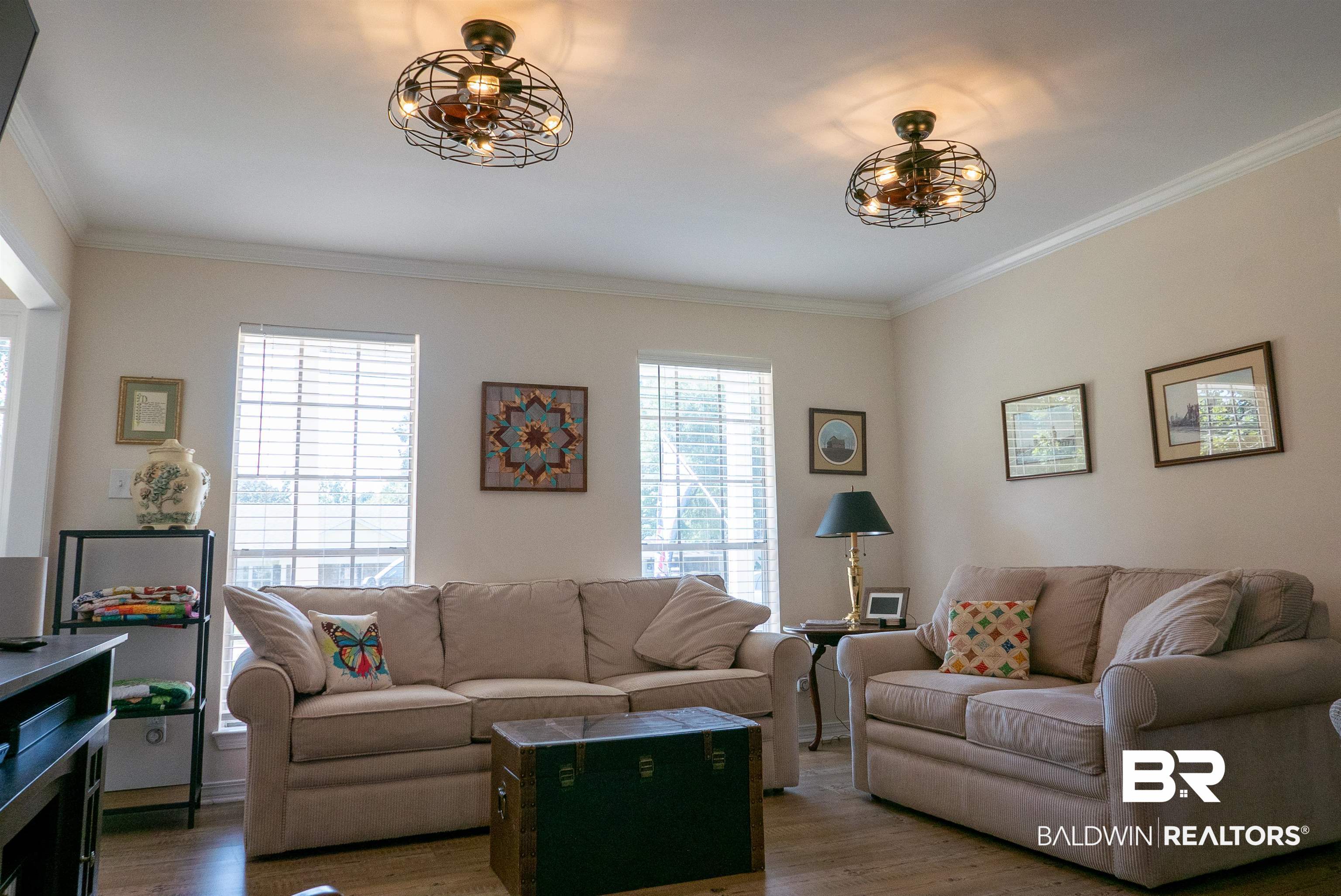 630 Spanish Main Daphne, AL 36527 - Photo 8 of 40 Living room featuring crown molding, dark hardwood / wood-style flooring, and plenty of natural light