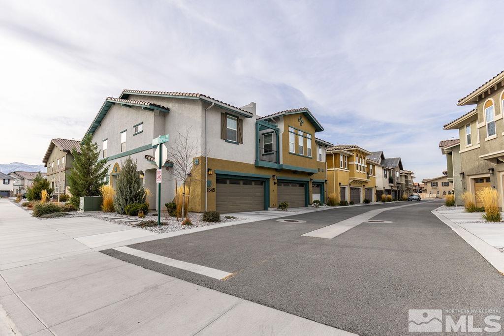 1845 Dark Horse Road, Unit B Reno, NV 89521 - Photo 12 of 25 a group of cars parked in front of a house