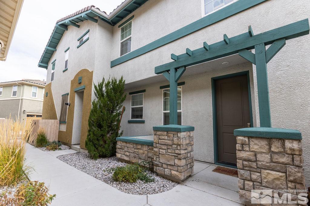 1845 Dark Horse Road, Unit B Reno, NV 89521 - Photo 14 of 25 a front view of a house with plants