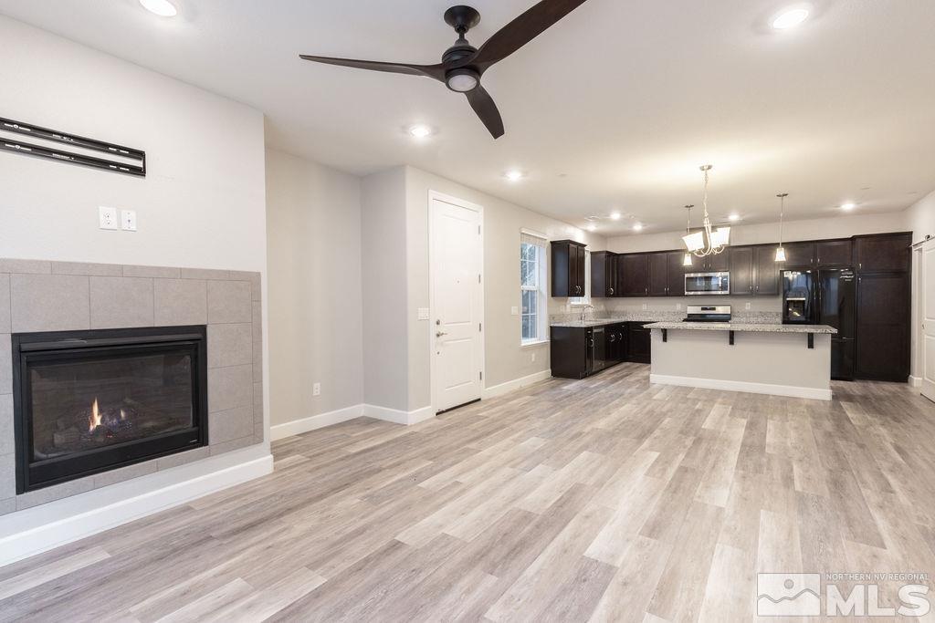 1845 Dark Horse Road, Unit B Reno, NV 89521 - Photo 2 of 25 a view of a kitchen with a sink and a microwave