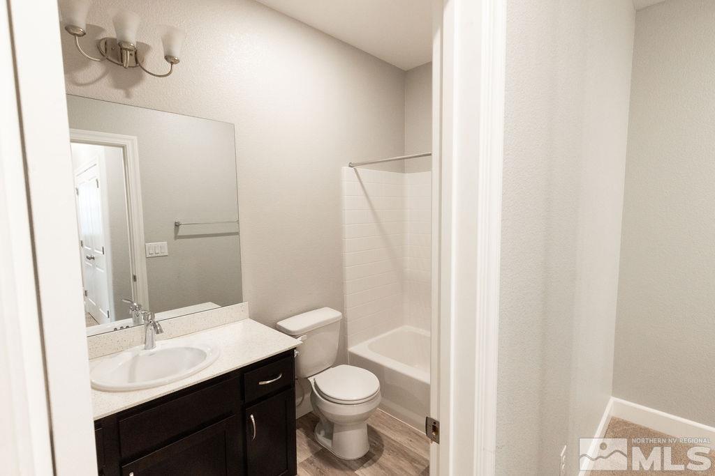 1845 Dark Horse Road, Unit B Reno, NV 89521 - Photo 7 of 25 a bathroom with a sink and a mirror