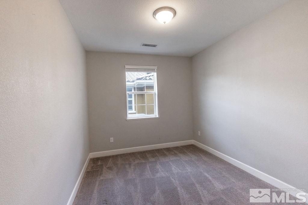 1845 Dark Horse Road, Unit B Reno, NV 89521 - Photo 8 of 25 an empty room with a window