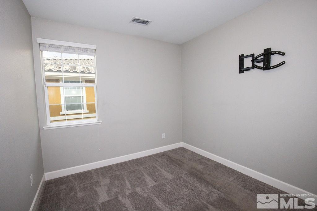 1845 Dark Horse Road, Unit B Reno, NV 89521 - Photo 9 of 25 a view of empty room with windows