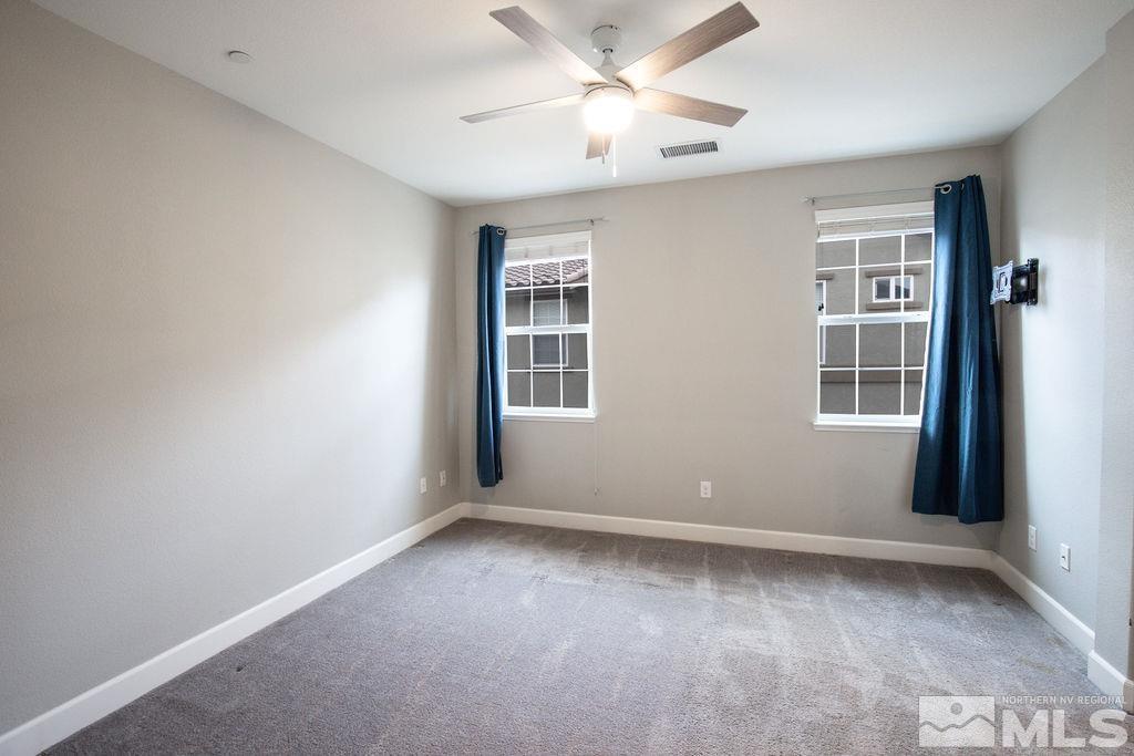 1845 Dark Horse Road, Unit B Reno, NV 89521 - Photo 10 of 25 a view of an empty room with a window
