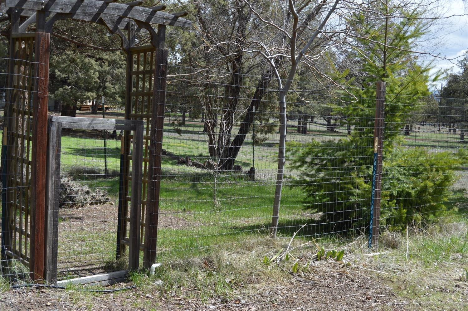 8280 Southwest Crater Loop Road Terrebonne, OR 97760 - Photo 13 of 25 A trellised gate to enter the backyard f