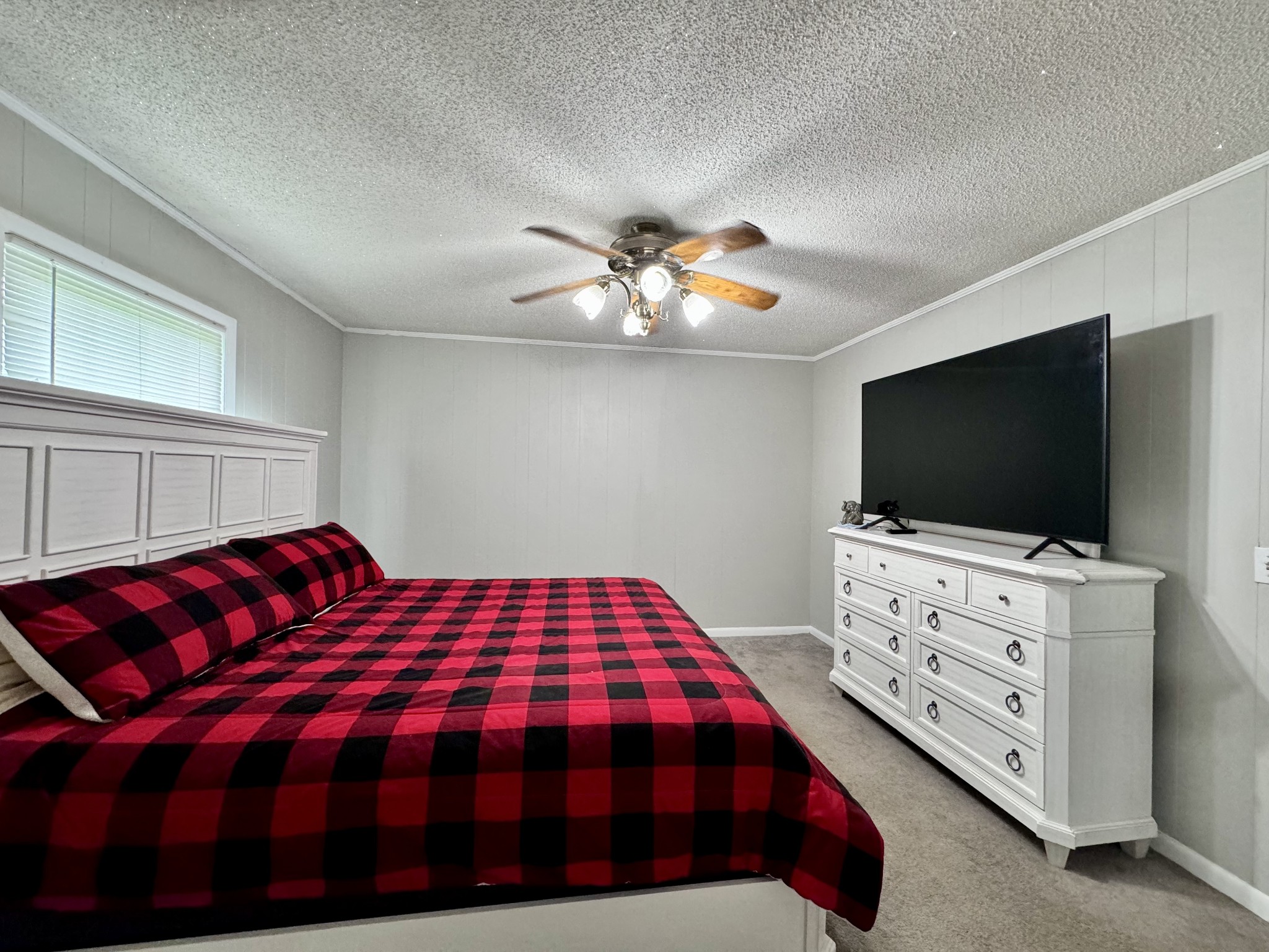 802 Days Road Lafayette, TN 37083 - Photo 11 of 25 a bedroom with a bed and a flat screen tv