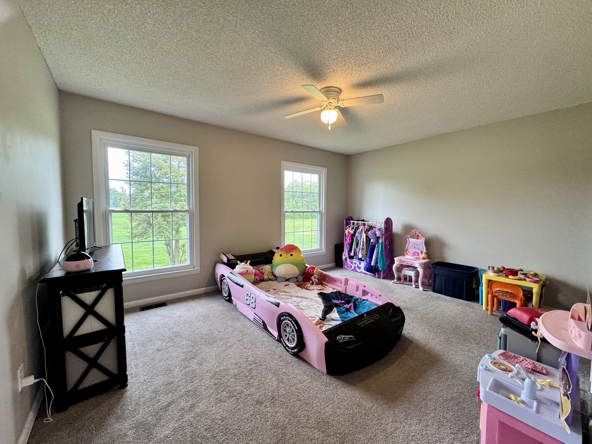 802 Days Road Lafayette, TN 37083 - Photo 14 of 25 a bedroom with a bed and a chandelier