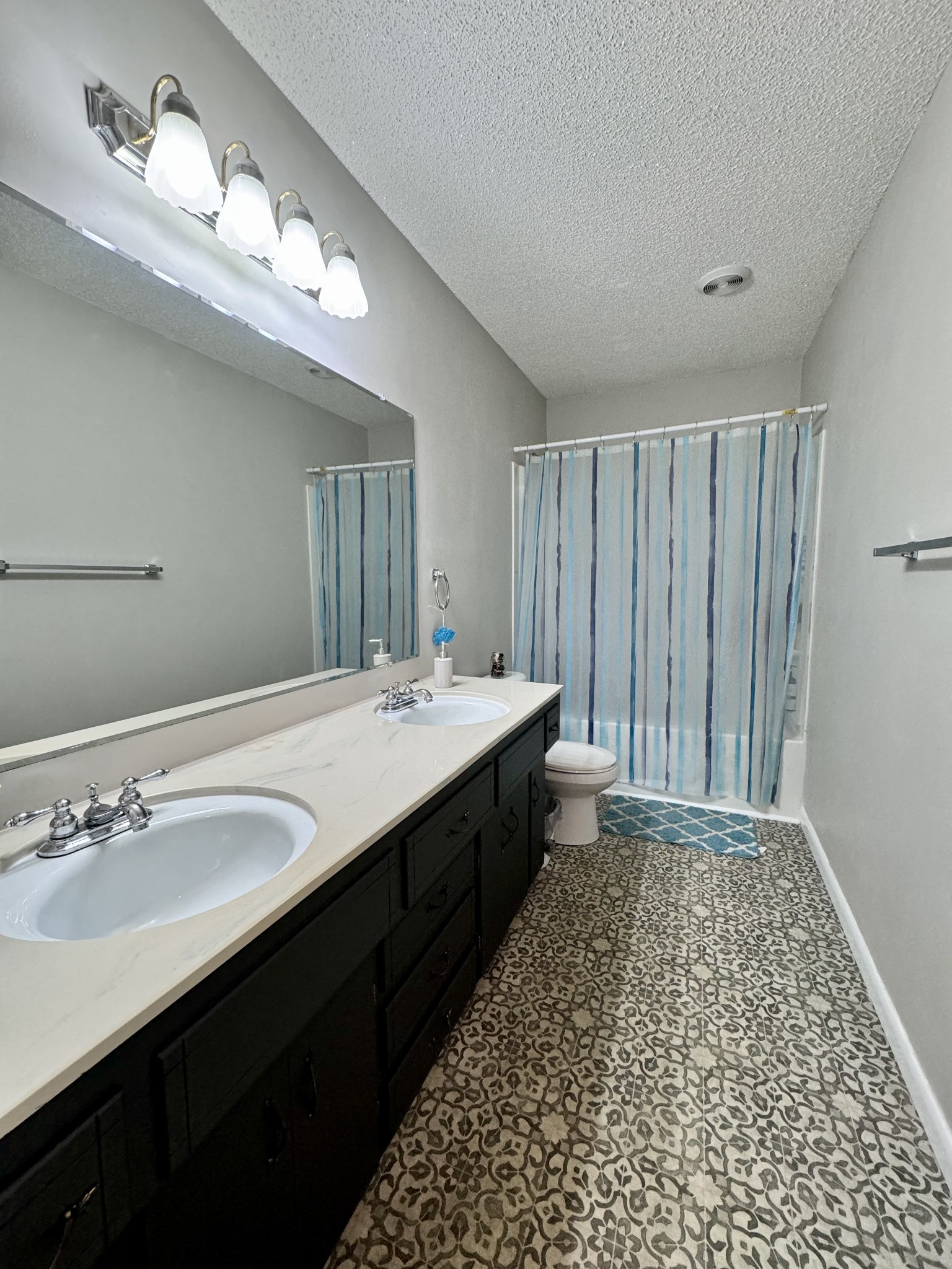 802 Days Road Lafayette, TN 37083 - Photo 17 of 25 a spacious bathroom with a double vanity sink and a mirror