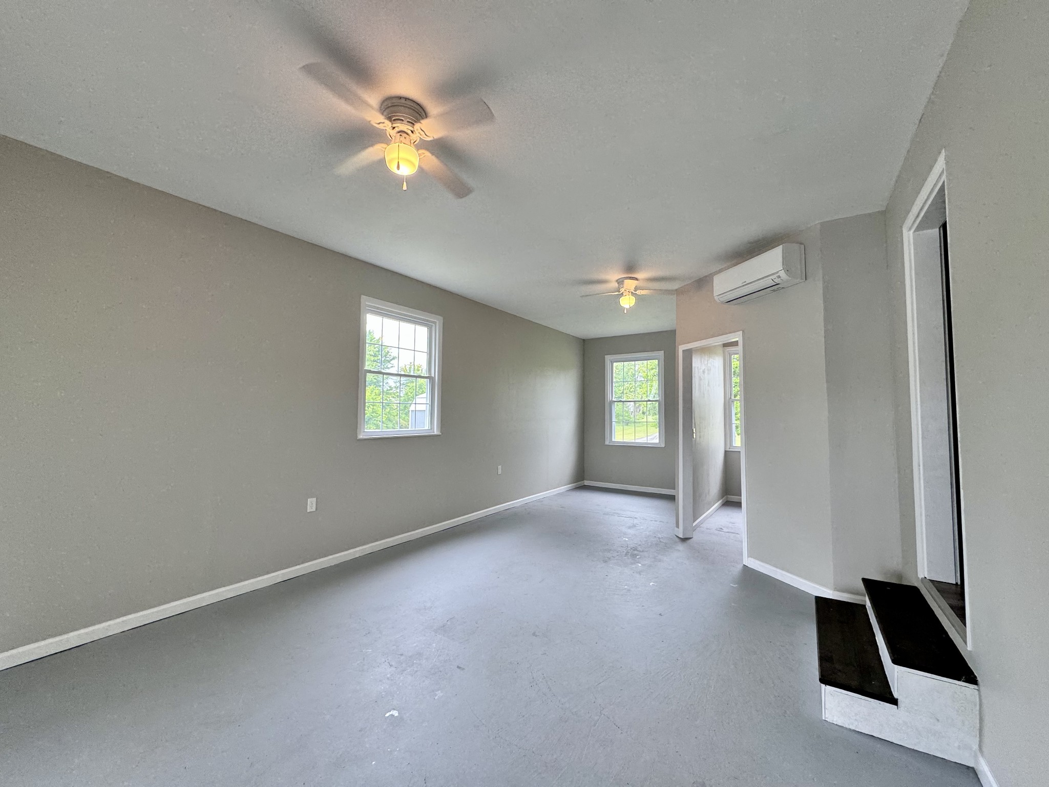 802 Days Road Lafayette, TN 37083 - Photo 19 of 25 a view of an empty room with window and a ceiling fan