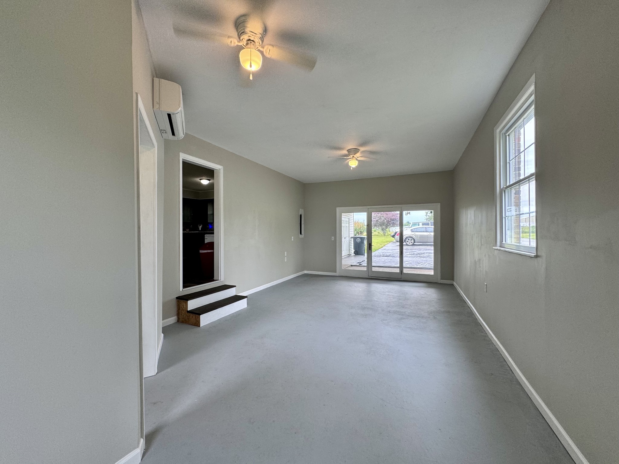 802 Days Road Lafayette, TN 37083 - Photo 20 of 25 an empty room with windows and fan