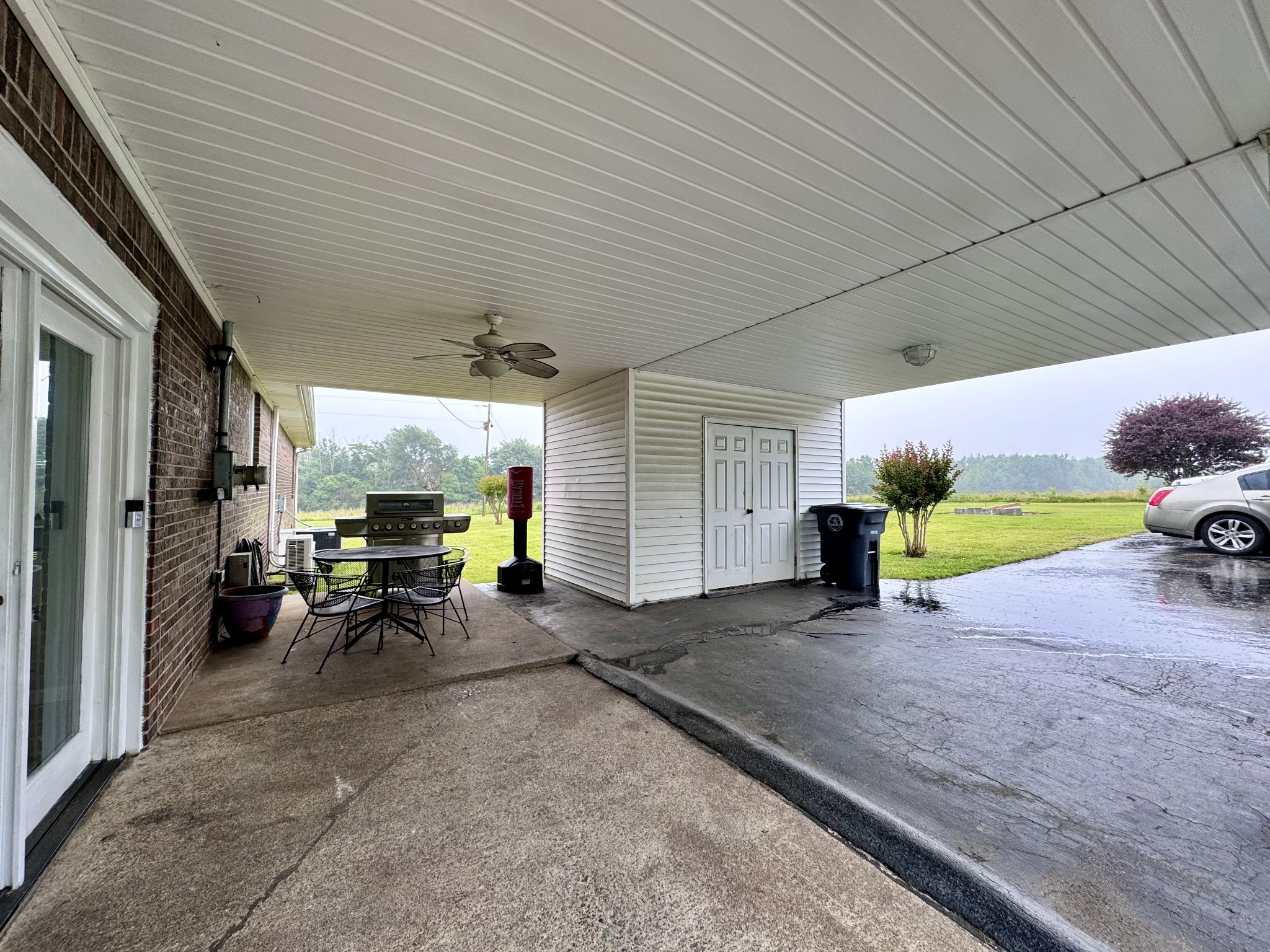 802 Days Road Lafayette, TN 37083 - Photo 21 of 25 a view of a porch with furniture and a yard