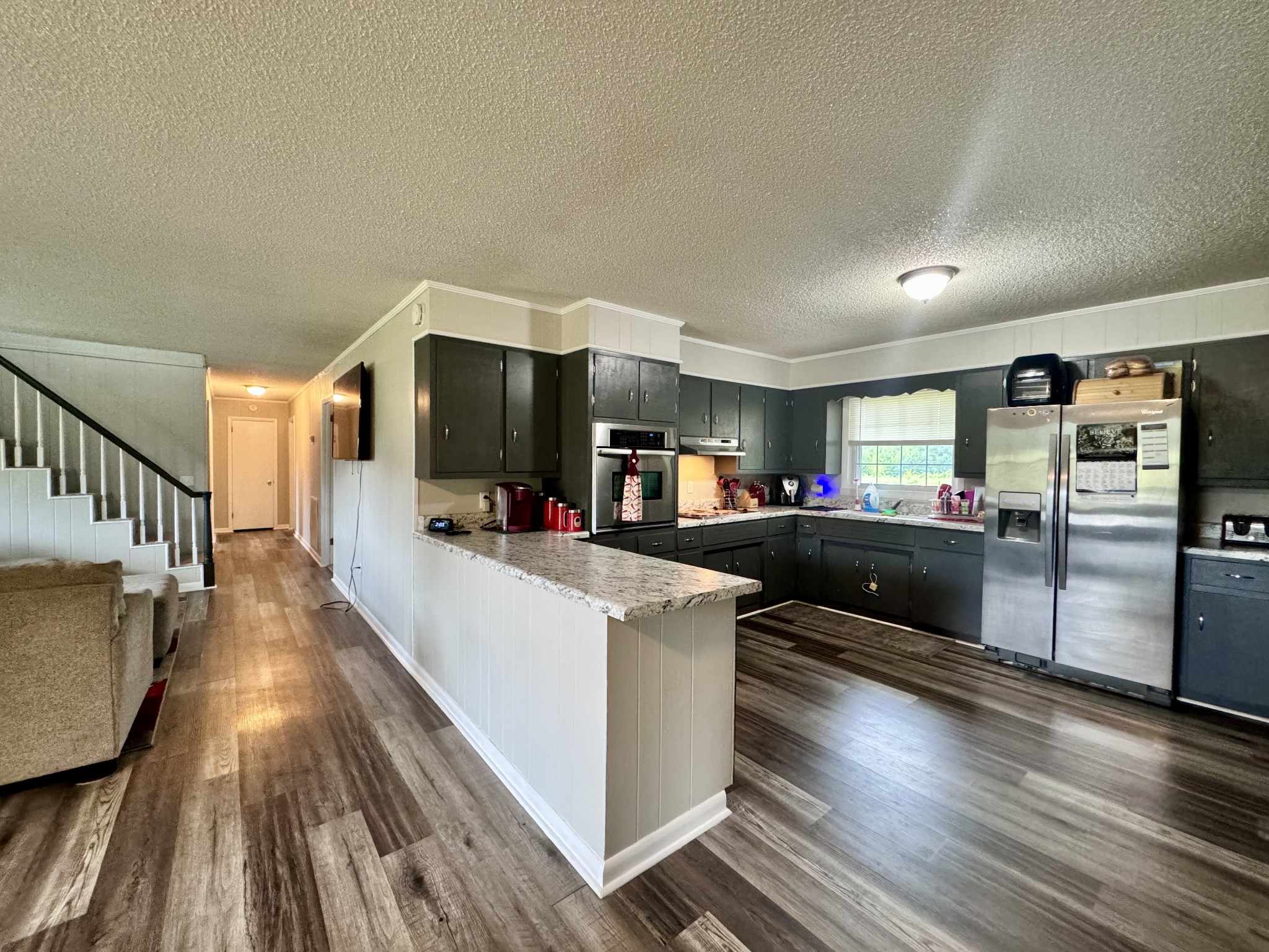 802 Days Road Lafayette, TN 37083 - Photo 6 of 25 a large kitchen with stainless steel appliances a large counter top