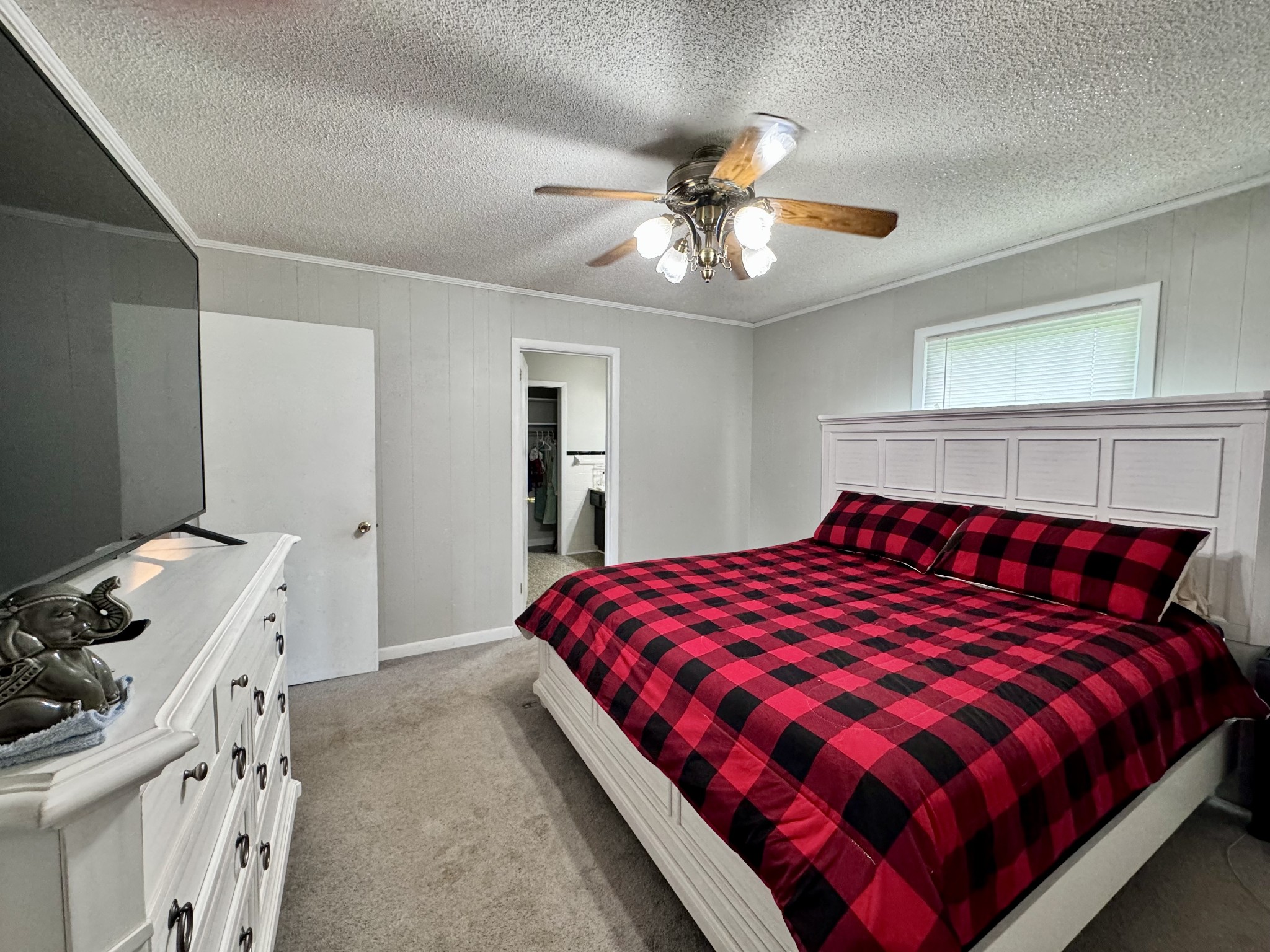 802 Days Road Lafayette, TN 37083 - Photo 10 of 25 a bedroom with a bed and a chandelier