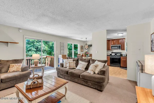 a living room with furniture and a large window