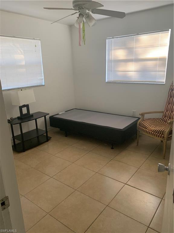 3325 Airport-Pulling Road North, Unit L1 Naples, FL 34105 - Photo 7 of 10 a bathroom with a sink and a mirror