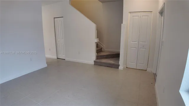 a kitchen with a sink cabinets and window