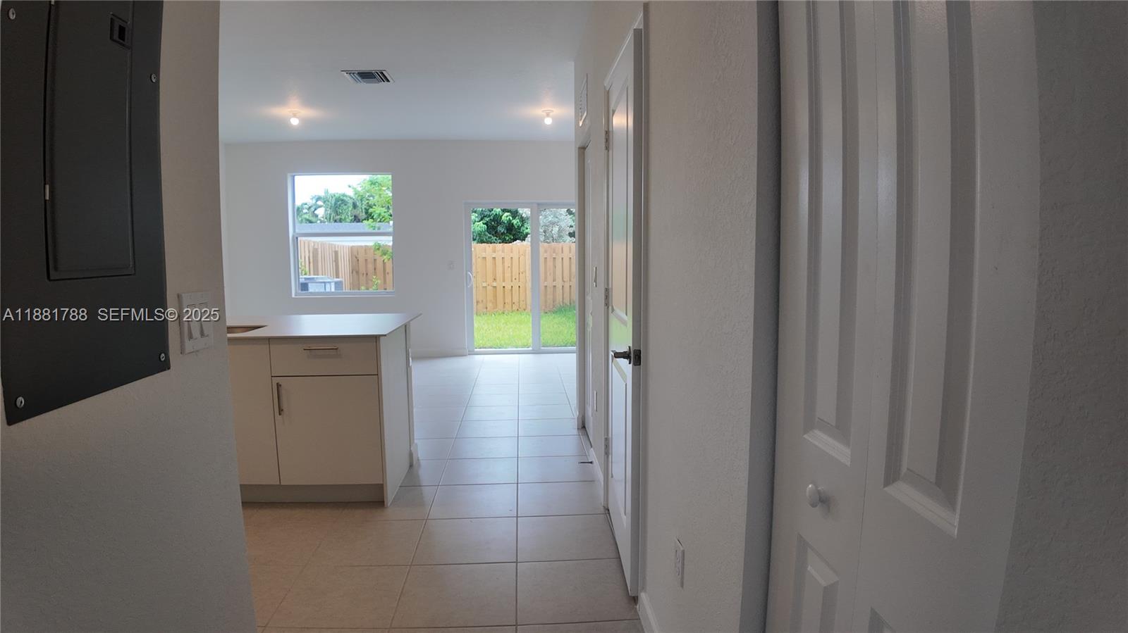 35761 Southwest 178th Court, Unit 35761 Homestead, FL 33034 - Photo 16 of 80 a view of kitchen with windows and closet