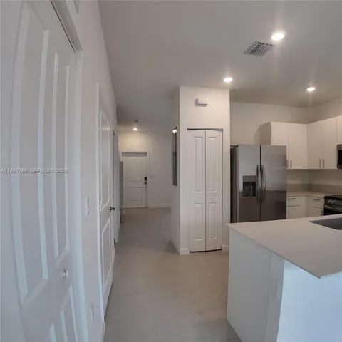 a view of a backyard with wooden fence