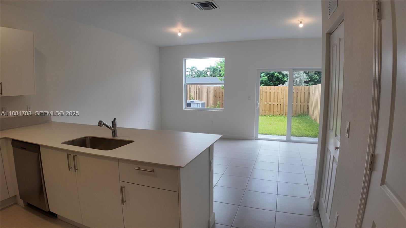 35761 Southwest 178th Court, Unit 35761 Homestead, FL 33034 - Photo 29 of 80 a kitchen with a sink and a window