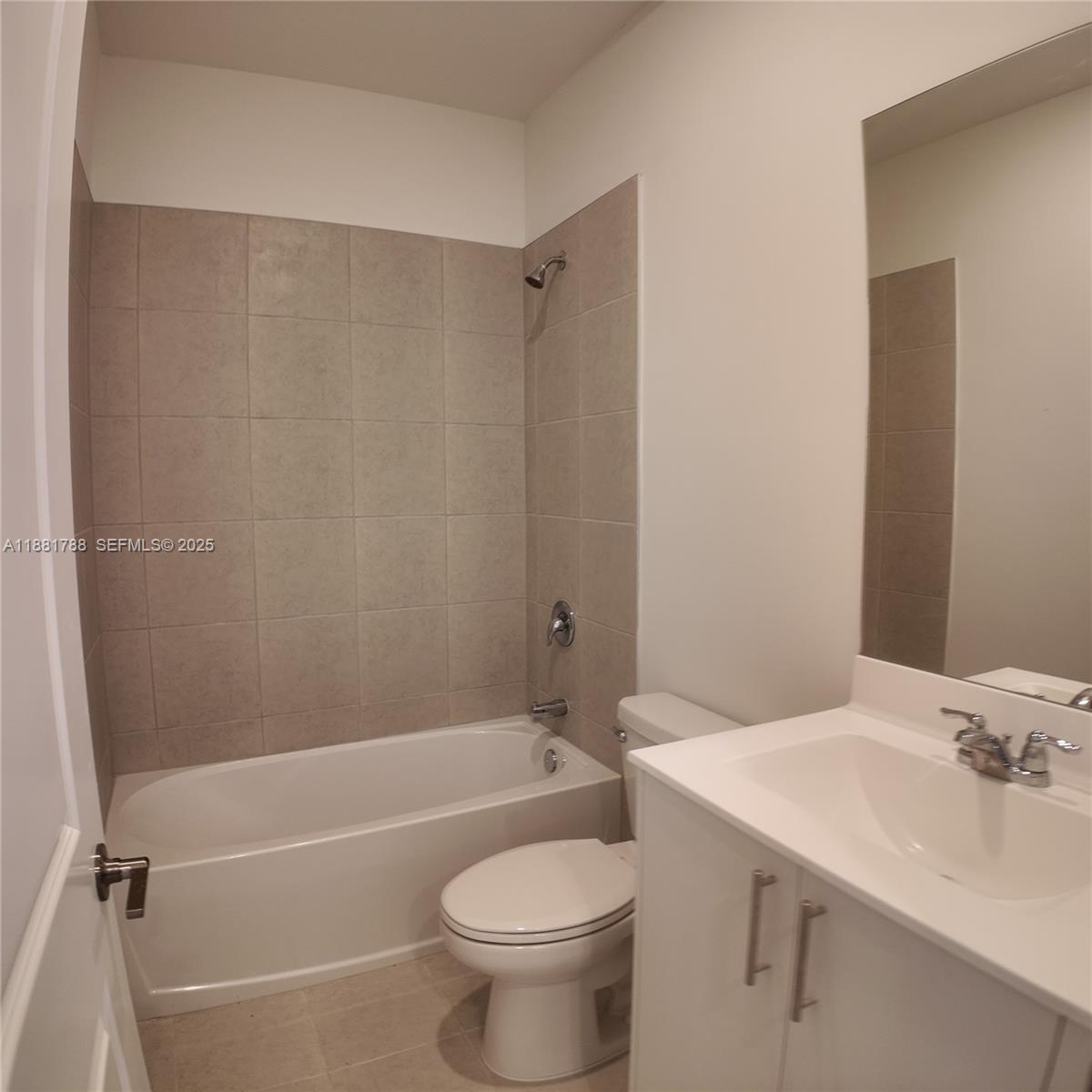 35761 Southwest 178th Court, Unit 35761 Homestead, FL 33034 - Photo 40 of 80 a bathroom with a sink a toilet and a bathtub