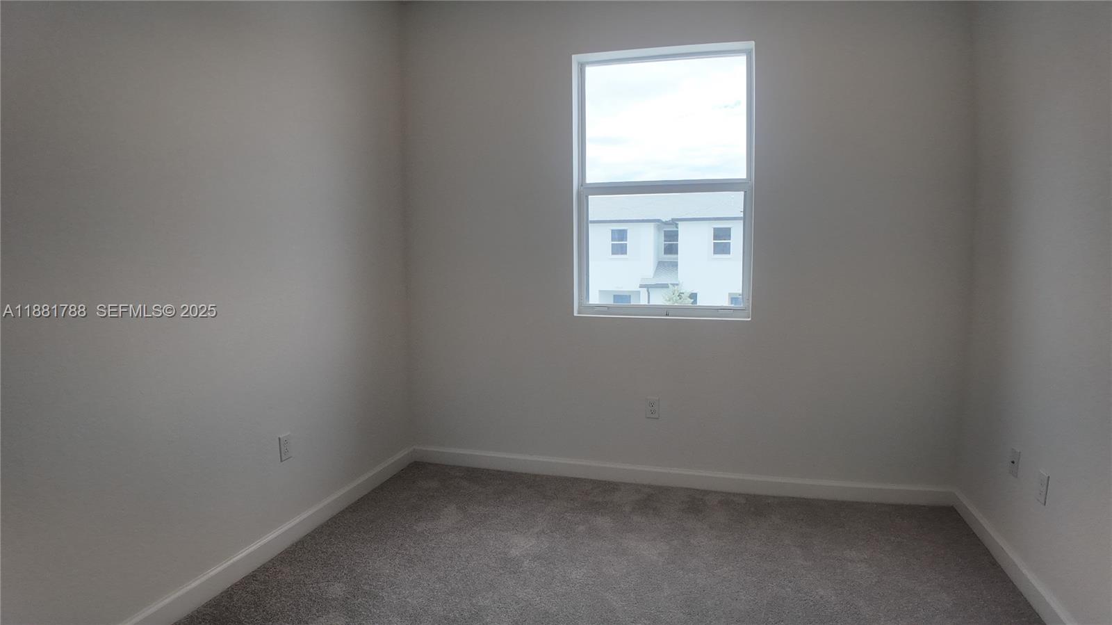 35761 Southwest 178th Court, Unit 35761 Homestead, FL 33034 - Photo 42 of 80 an empty room with a window