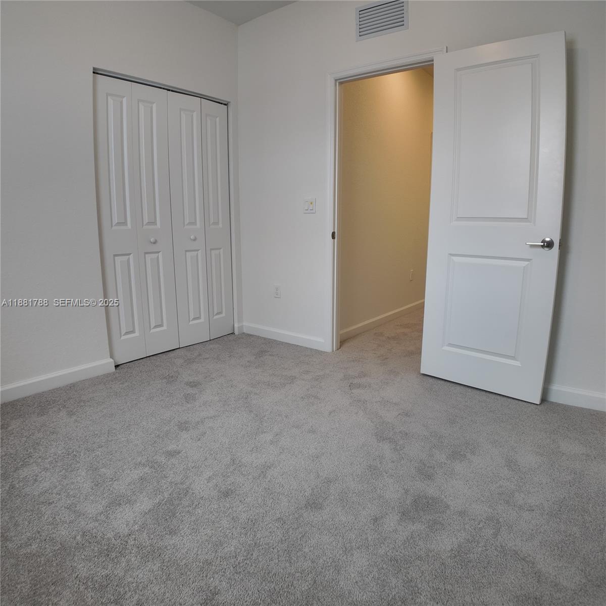 35761 Southwest 178th Court, Unit 35761 Homestead, FL 33034 - Photo 43 of 80 an empty room with closet area