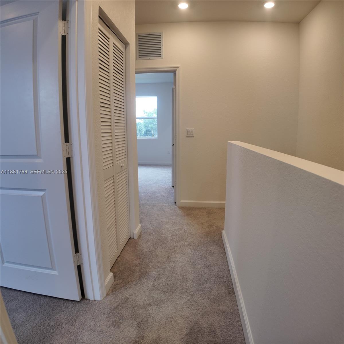 35761 Southwest 178th Court, Unit 35761 Homestead, FL 33034 - Photo 44 of 80 a view of a hallway with closet