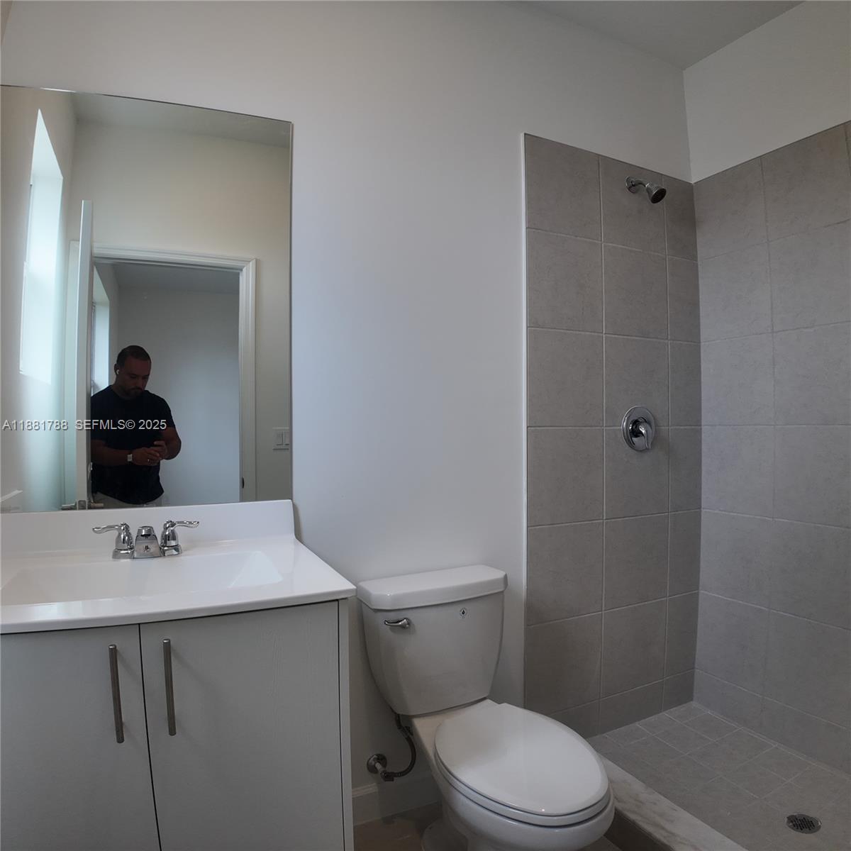 35761 Southwest 178th Court, Unit 35761 Homestead, FL 33034 - Photo 48 of 80 a bathroom with a sink a toilet and shower