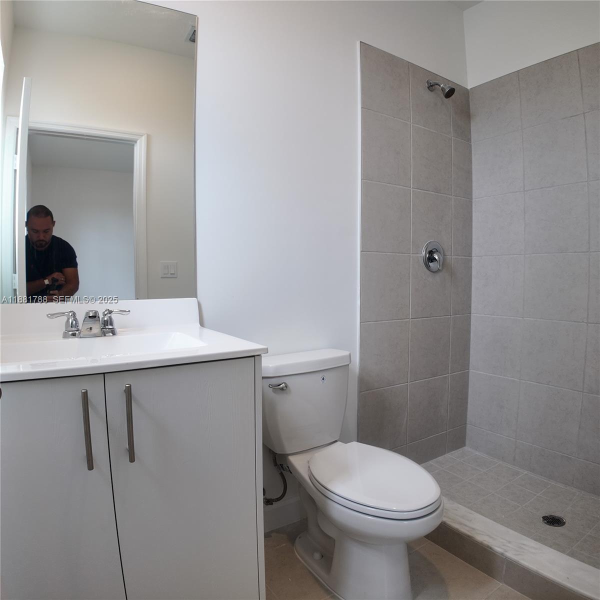 35761 Southwest 178th Court, Unit 35761 Homestead, FL 33034 - Photo 49 of 80 a bathroom with a sink toilet and shower