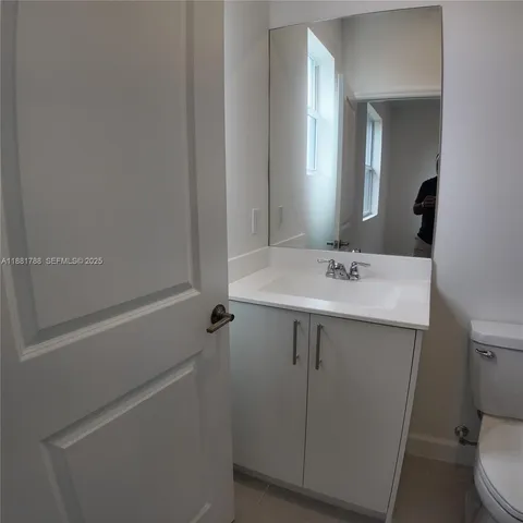 a view of a backyard with a fence