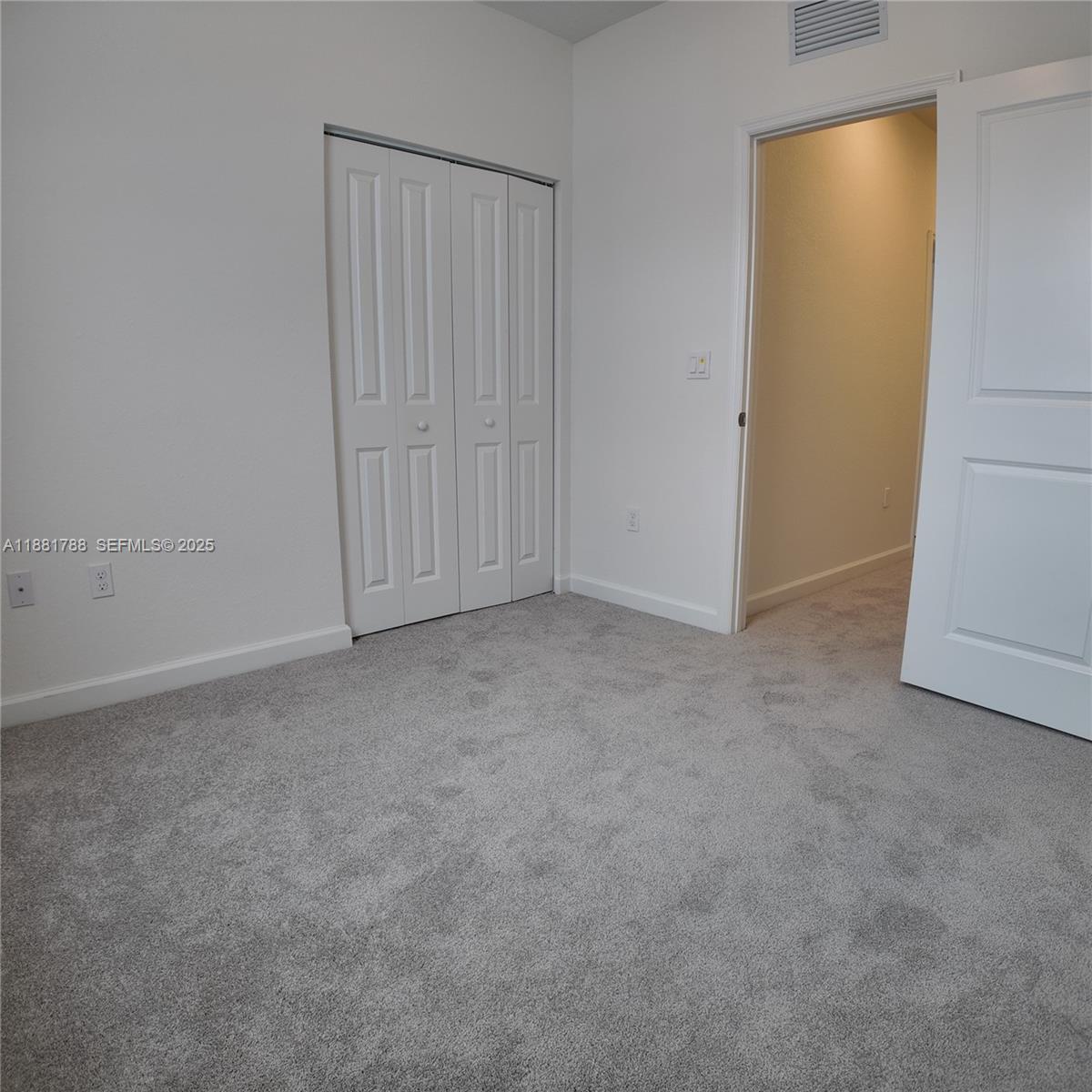 35761 Southwest 178th Court, Unit 35761 Homestead, FL 33034 - Photo 6 of 80 an empty room with closet area