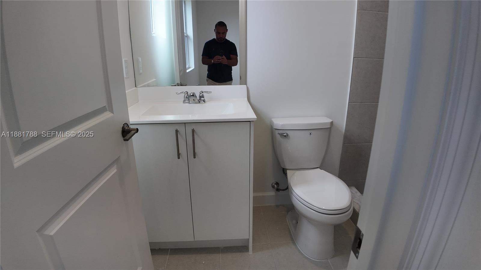 35761 Southwest 178th Court, Unit 35761 Homestead, FL 33034 - Photo 61 of 80 a bathroom with a toilet and a sink
