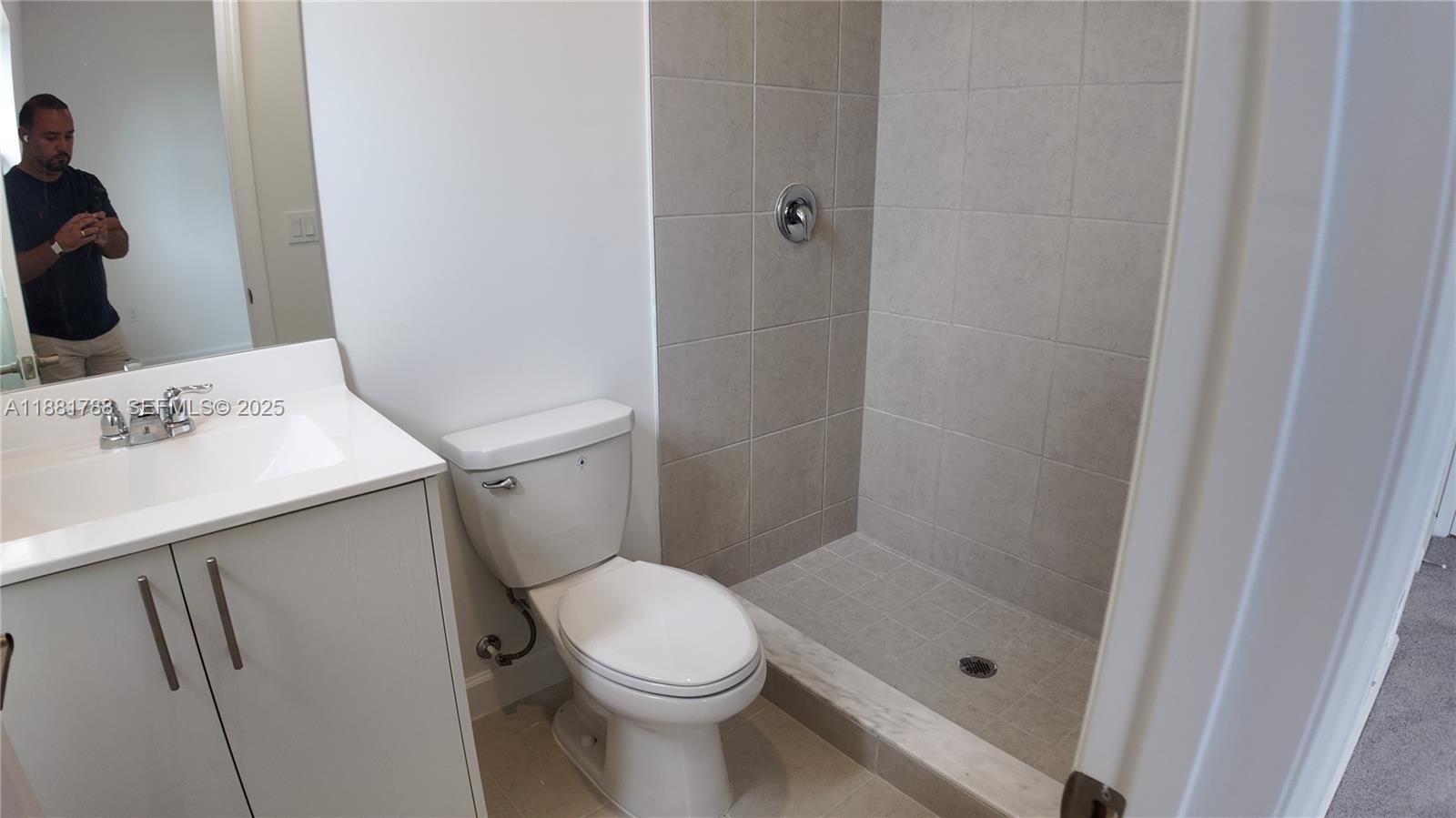 35761 Southwest 178th Court, Unit 35761 Homestead, FL 33034 - Photo 62 of 80 a bathroom with a sink a toilet and shower
