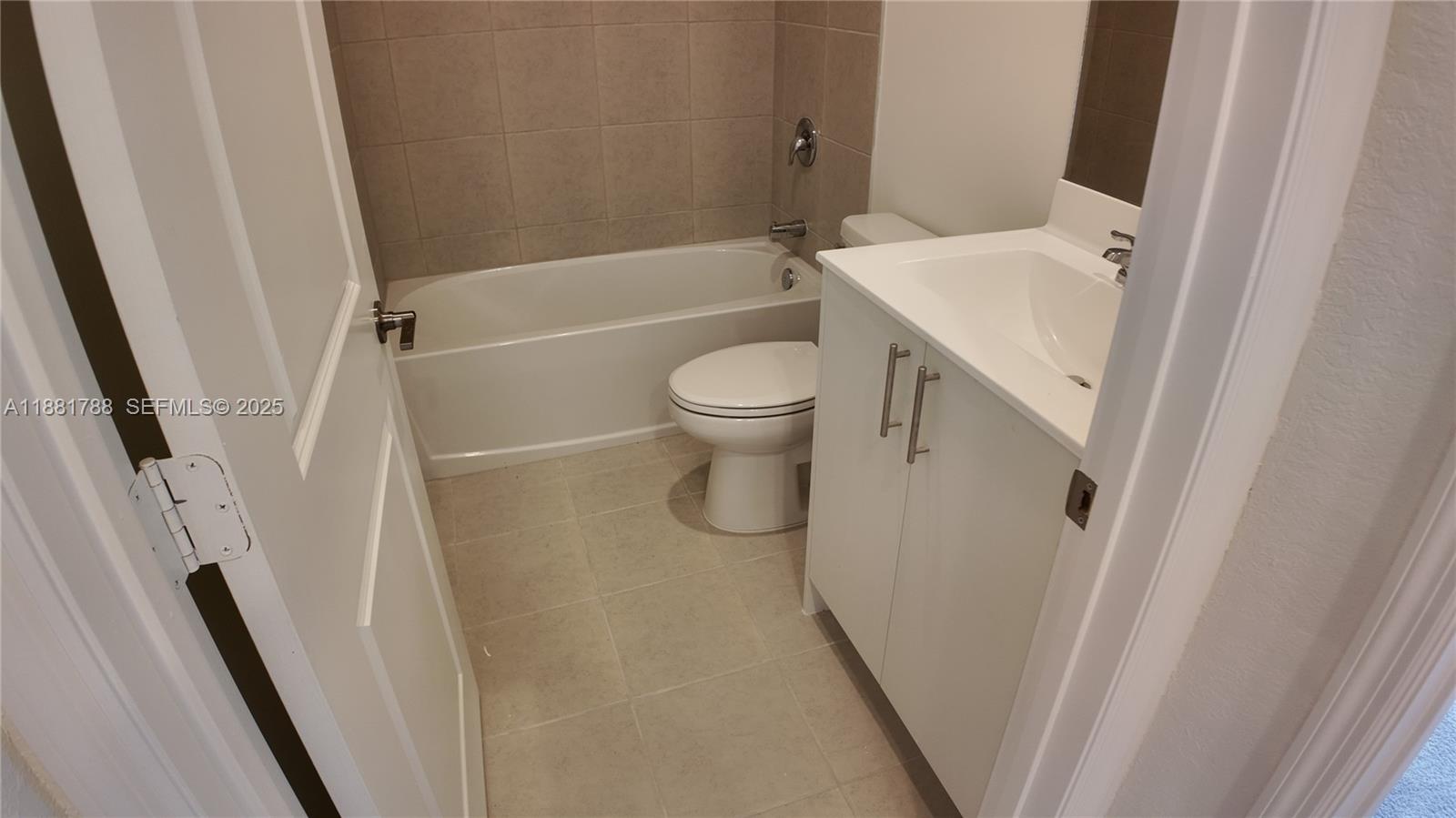 35761 Southwest 178th Court, Unit 35761 Homestead, FL 33034 - Photo 65 of 80 a bathroom with a sink and a toilet