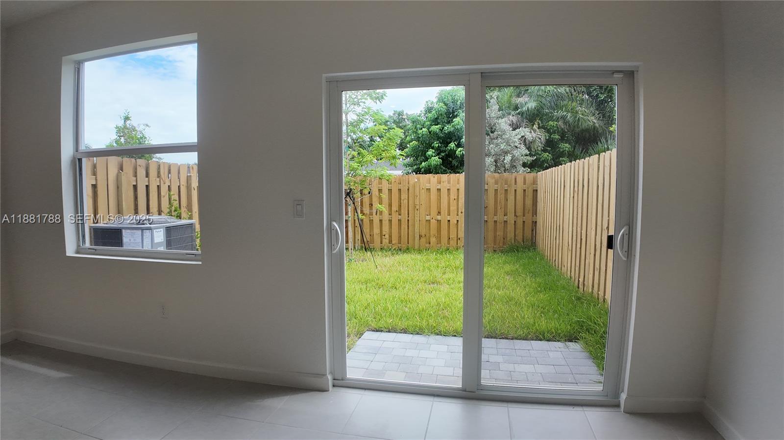 35761 Southwest 178th Court, Unit 35761 Homestead, FL 33034 - Photo 68 of 80 a view of porch with a backyard
