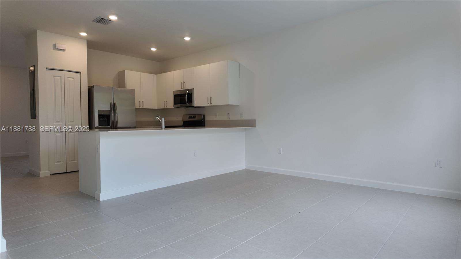 35761 Southwest 178th Court, Unit 35761 Homestead, FL 33034 - Photo 73 of 80 a kitchen with a sink stainless steel appliances and cabinets