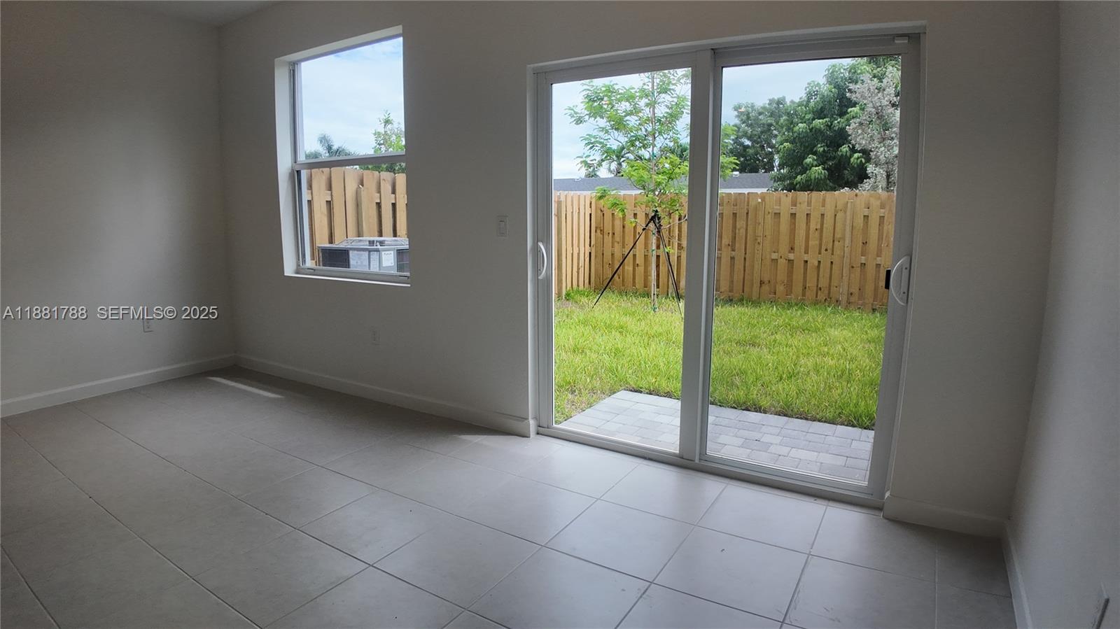35761 Southwest 178th Court, Unit 35761 Homestead, FL 33034 - Photo 77 of 80 a view of an empty room and window