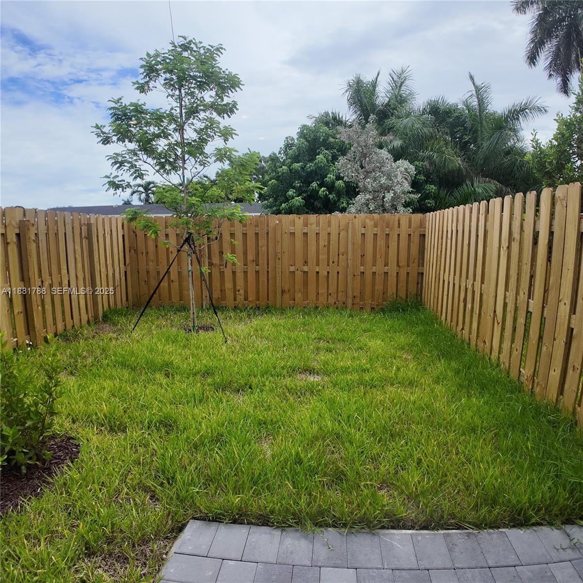 35761 Southwest 178th Court, Unit 35761 Homestead, FL 33034 - Photo 80 of 80 a view of a backyard with a fence