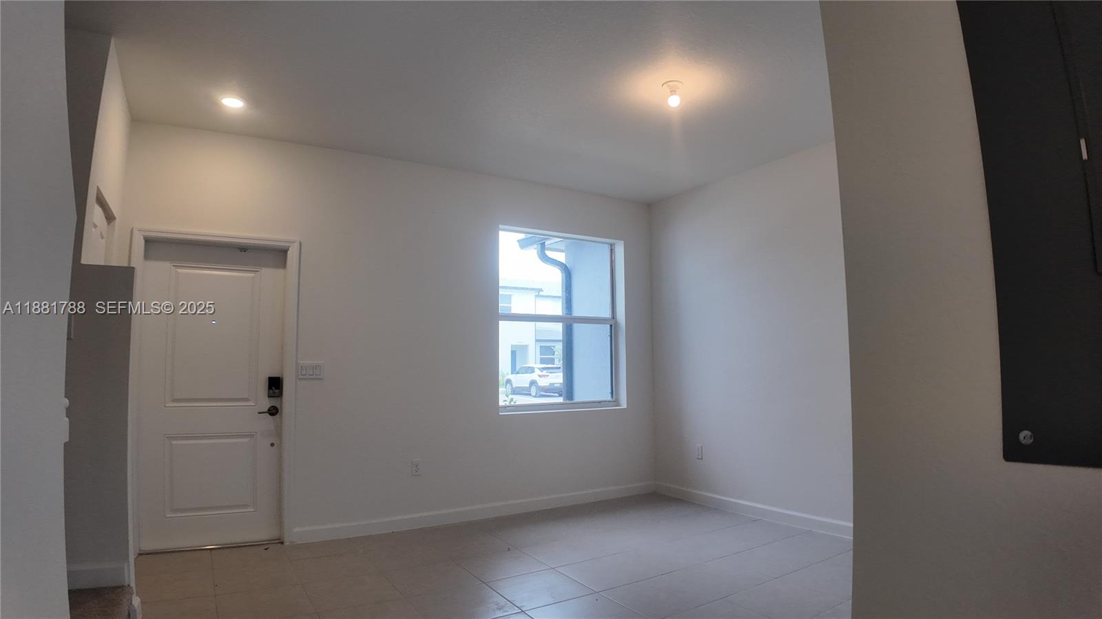 35761 Southwest 178th Court, Unit 35761 Homestead, FL 33034 - Photo 9 of 80 an empty room with windows and closet