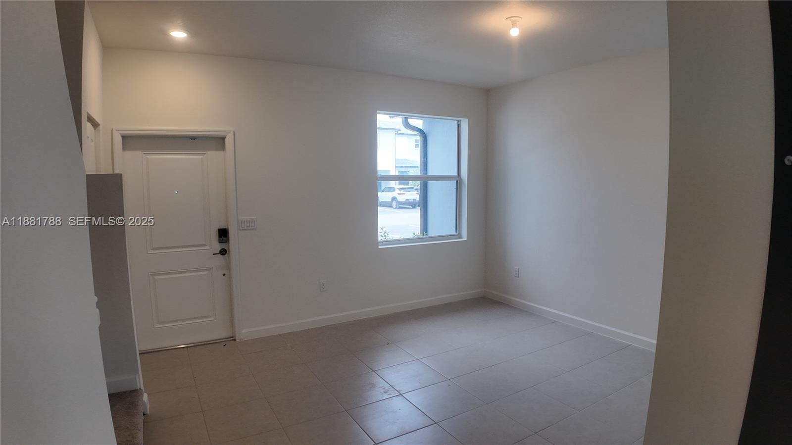 35761 Southwest 178th Court, Unit 35761 Homestead, FL 33034 - Photo 10 of 80 an empty room with windows and closet