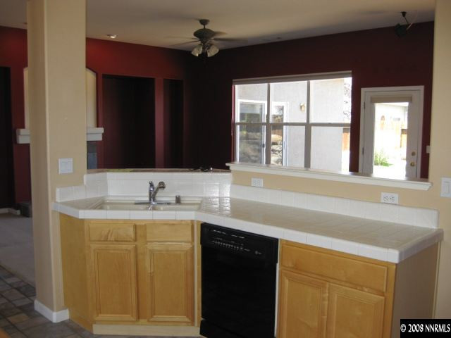 1595 Sutterbrook Way Reno, NV 89521 - Photo 3 of 9 a bathroom with a sink a vanity and a mirror