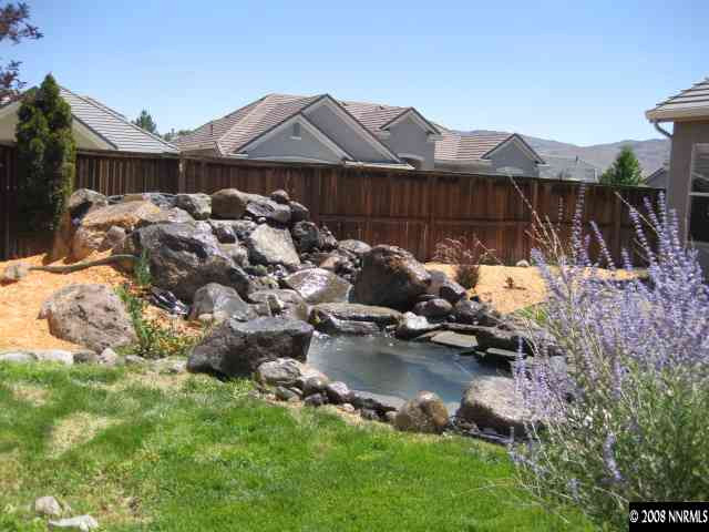 1595 Sutterbrook Way Reno, NV 89521 - Photo 8 of 9 a view of a house with a yard and sitting area with furniture